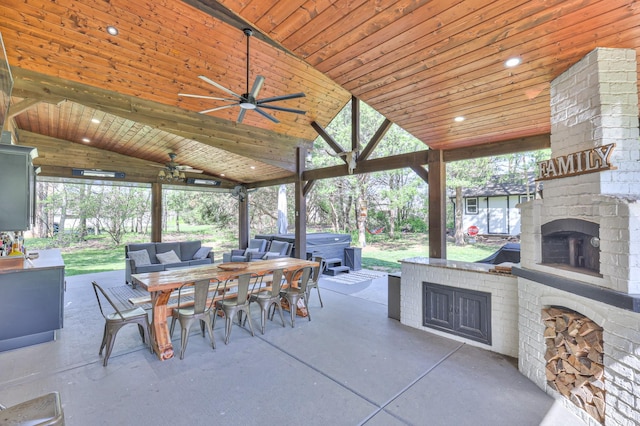 831 W Sagefield Dr, Smyrna, TN 37167 - view of patio featuring exterior fireplace, outdoor dining area, ceiling fan, and a hot tub