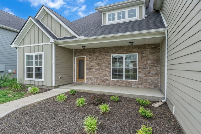 404 Generosity Way, Smyrna, TN 37167 - property entrance featuring board and batten siding, stone siding, and a shingled roof