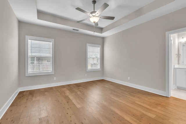 404 Generosity Way, Smyrna, TN 37167 - unfurnished room with light wood finished floors, a raised ceiling, ceiling fan, and baseboards