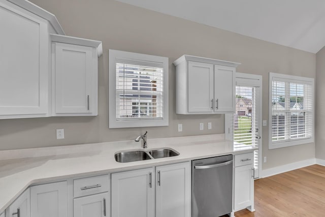 404 Generosity Way, Smyrna, TN 37167 - kitchen with dishwasher, a sink, white cabinetry, light countertops, and light wood-type flooring