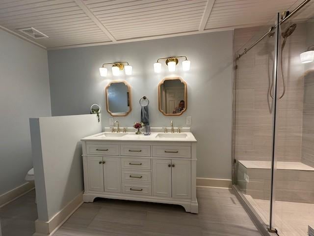 210 Kerr Ave, Murfreesboro, TN 37130 - bathroom with double vanity, baseboards, toilet, a shower stall, and wood finished floors