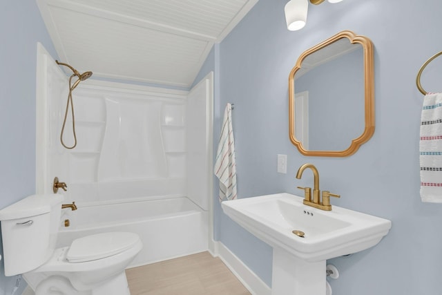 210 Kerr Ave, Murfreesboro, TN 37130 - bathroom featuring toilet, tub / shower combination, wood finished floors, a sink, and vaulted ceiling
