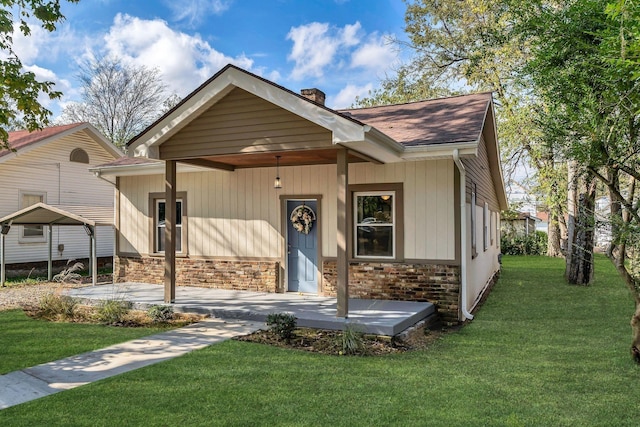 210 Kerr Ave, Murfreesboro, TN 37130 - view of front of property featuring a chimney, a front lawn, a shingled roof, and a porch