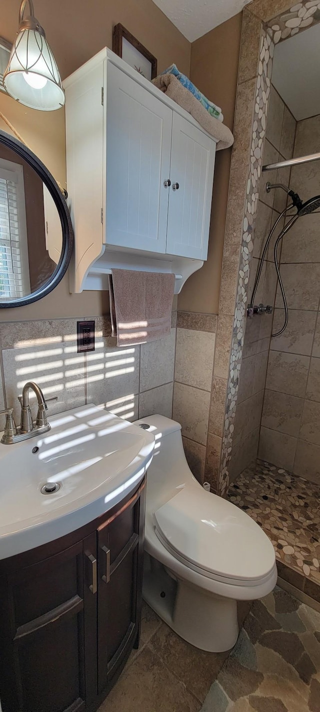 208 Royal Oak Dr, Dickson, TN 37055 - full bath featuring a stall shower, vanity, toilet, and tile walls