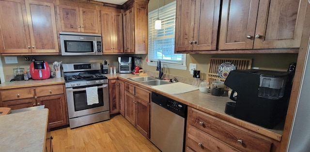 208 Royal Oak Dr, Dickson, TN 37055 - kitchen featuring stainless steel appliances, a sink, and brown cabinetry