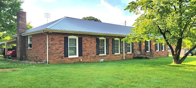 208 Royal Oak Dr, Dickson, TN 37055 - view of side of property featuring brick siding, a lawn, a chimney, and metal roof