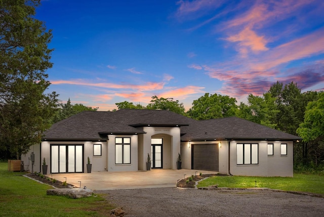1240 John Windrow Rd, Eagleville, TN 37060 - view of front of property with concrete driveway, a garage, and a lawn