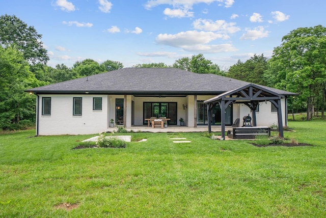 1240 John Windrow Rd, Eagleville, TN 37060 - rear view of house featuring a yard, a gazebo, a patio, and a shingled roof