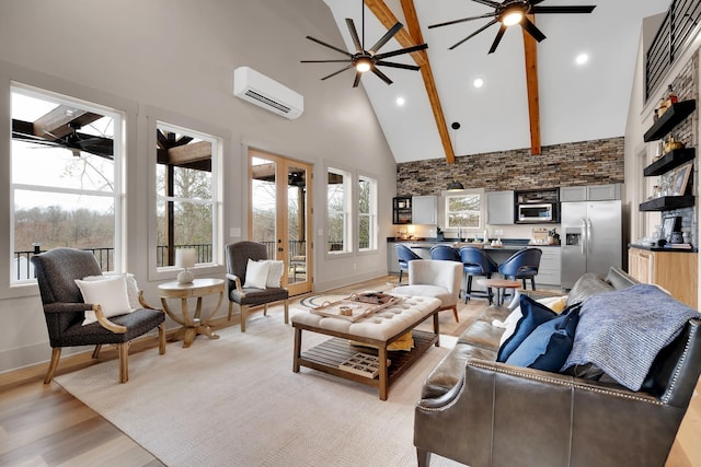 44 Hasty Hill Rd, Lynchburg, TN 37352 - living area with an AC wall unit, high vaulted ceiling, a ceiling fan, light wood-style floors, and baseboards