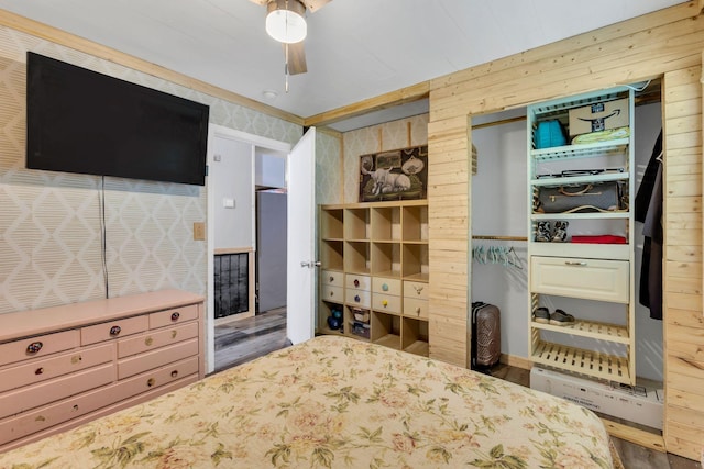 9780 S Lick Creek Rd SW, Lyles, TN 37098 - bedroom featuring wood finished floors, wood walls, and a ceiling fan