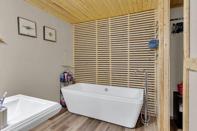 9780 S Lick Creek Rd SW, Lyles, TN 37098 - full bath with wooden ceiling, a soaking tub, and wood finished floors
