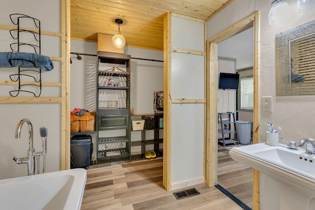 9780 S Lick Creek Rd SW, Lyles, TN 37098 - bathroom with wood finished floors, wooden ceiling, and a sink