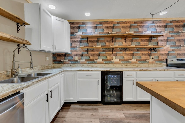9780 S Lick Creek Rd SW, Lyles, TN 37098 - kitchen with beverage cooler, dishwasher, a sink, white cabinets, and tasteful backsplash
