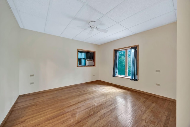 943 Old Ccc Rd, Sewanee, TN 37375 - empty room with a paneled ceiling, light wood-style flooring, a ceiling fan, baseboards, and cooling unit