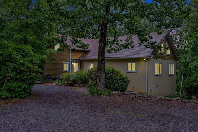 943 Old Ccc Rd, Sewanee, TN 37375 - view of property exterior featuring stucco siding and gravel driveway