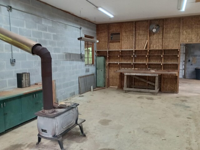 943 Old Ccc Rd, Sewanee, TN 37375 - below grade area featuring a wood stove and concrete block wall