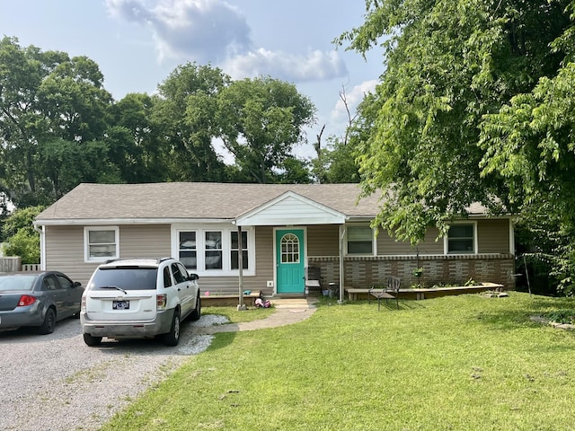 505 Wesley Ave, Nashville, TN 37207 - single story home with a front yard, a shingled roof, and brick siding