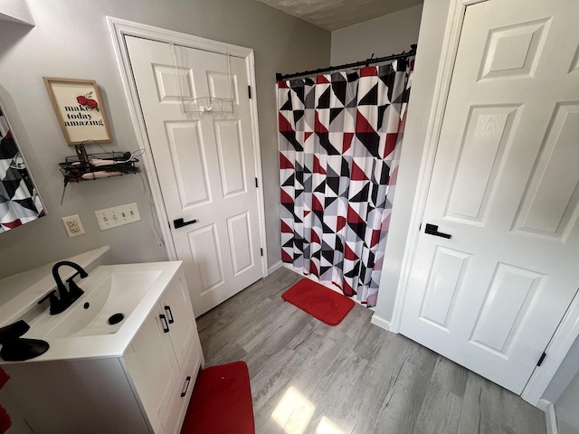 505 Wesley Ave, Nashville, TN 37207 - bathroom with vanity, wood finished floors, and a shower with curtain