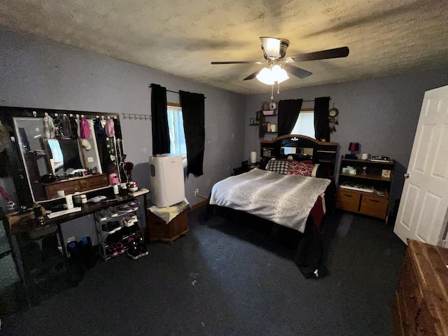 505 Wesley Ave, Nashville, TN 37207 - bedroom featuring dark colored carpet, ceiling fan, and a textured ceiling