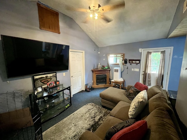 505 Wesley Ave, Nashville, TN 37207 - living area with dark carpet, a ceiling fan, vaulted ceiling, and a fireplace