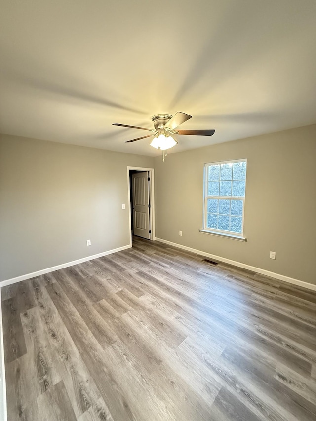 507 Locust St, Mcminnville, TN 37110 - spare room with wood finished floors, baseboards, and ceiling fan