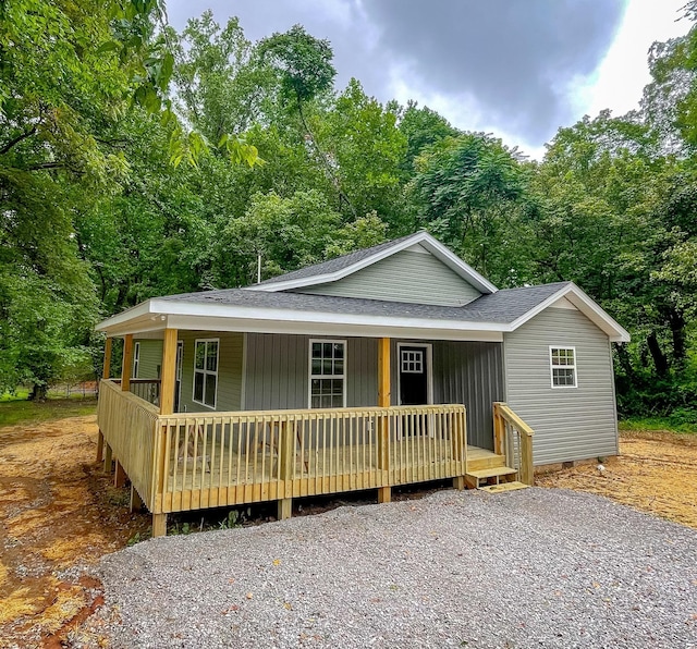 507 Locust St, Mcminnville, TN 37110 - view of front facade featuring a porch, a shingled roof, and a view of trees