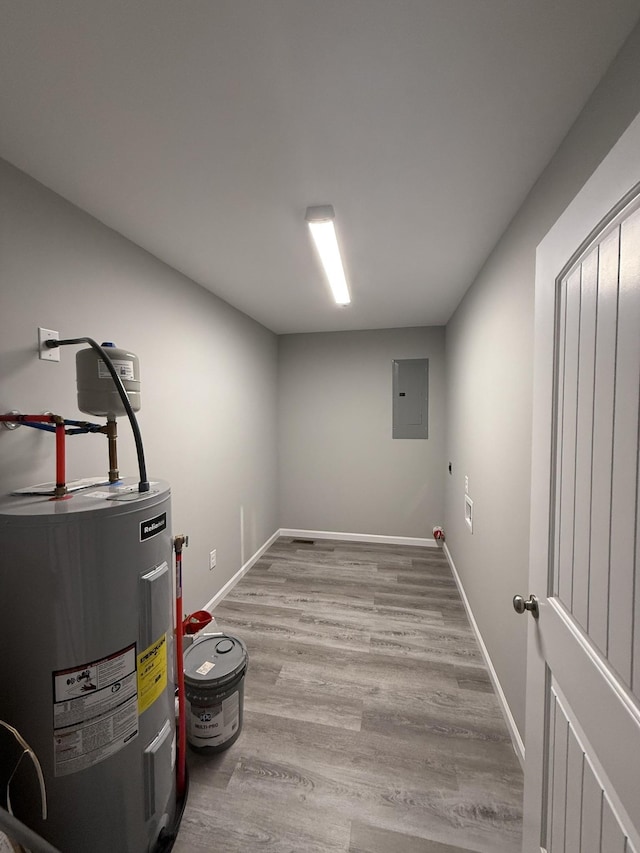 507 Locust St, Mcminnville, TN 37110 - finished below grade area featuring electric panel, water heater, wood finished floors, and baseboards