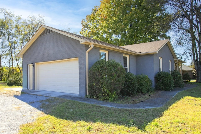 321 Amherst Dr, Murfreesboro, TN 37128 - view of property exterior with brick siding, an attached garage, and a lawn