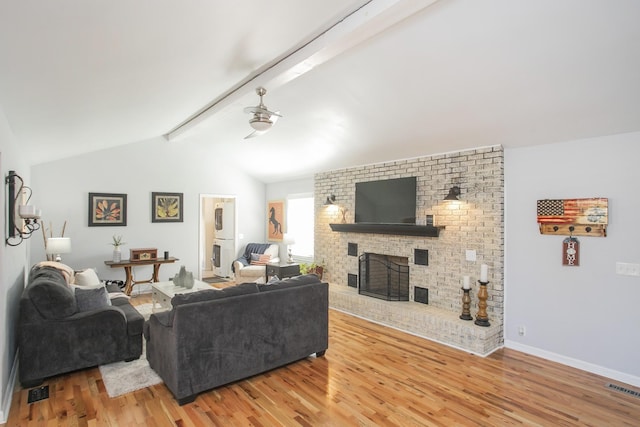 321 Amherst Dr, Murfreesboro, TN 37128 - living room with wood finished floors, a brick fireplace, a ceiling fan, and baseboards