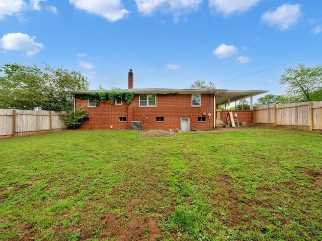 189 Washington Ave, Camden, TN 38320 - back of house featuring a chimney, brick siding, and central AC unit