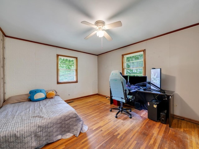 189 Washington Ave, Camden, TN 38320 - bedroom with wood finished floors, baseboards, crown molding, and a ceiling fan
