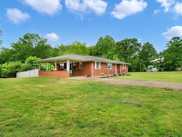 189 Washington Ave, Camden, TN 38320 - ranch-style house featuring brick siding and gravel driveway
