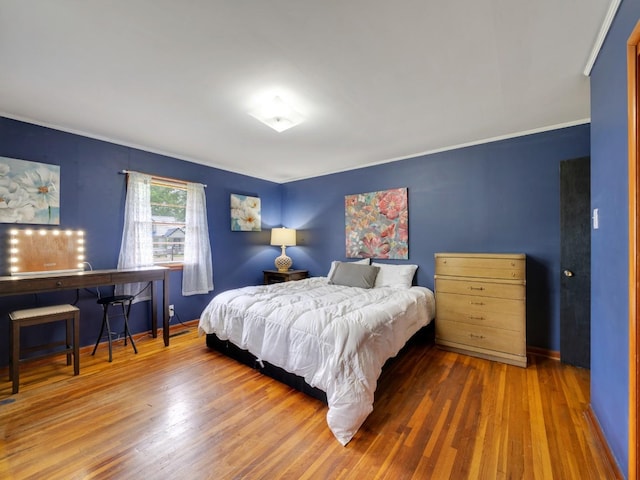 189 Washington Ave, Camden, TN 38320 - bedroom with wood finished floors, baseboards, and crown molding