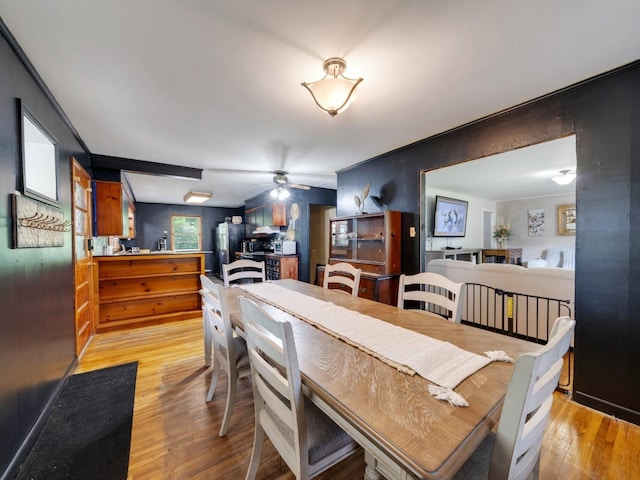 189 Washington Ave, Camden, TN 38320 - dining space with light wood finished floors and a ceiling fan