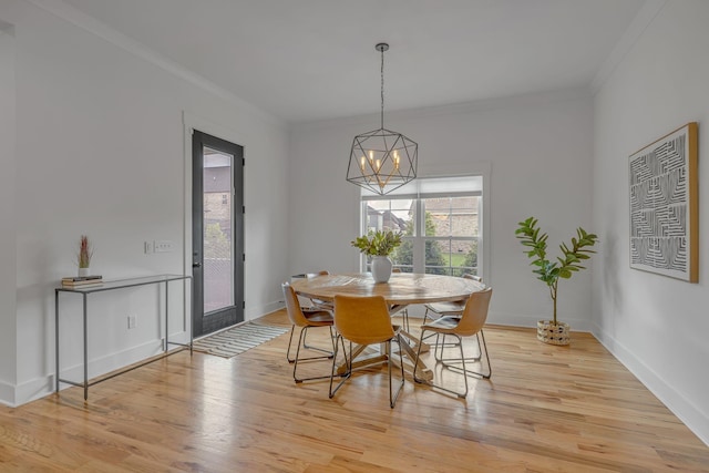 609 Dallas Ct, Murfreesboro, TN 37130 - dining area with ornamental molding, a chandelier, light wood-style floors, and baseboards