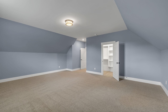 609 Dallas Ct, Murfreesboro, TN 37130 - additional living space featuring vaulted ceiling, baseboards, and light carpet