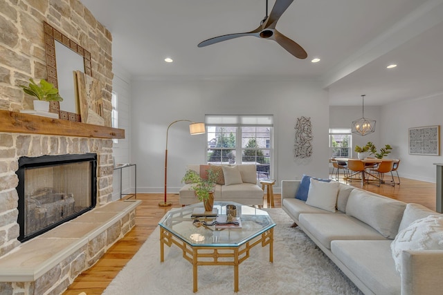 609 Dallas Ct, Murfreesboro, TN 37130 - living room with light wood finished floors, ceiling fan, a stone fireplace, recessed lighting, and baseboards