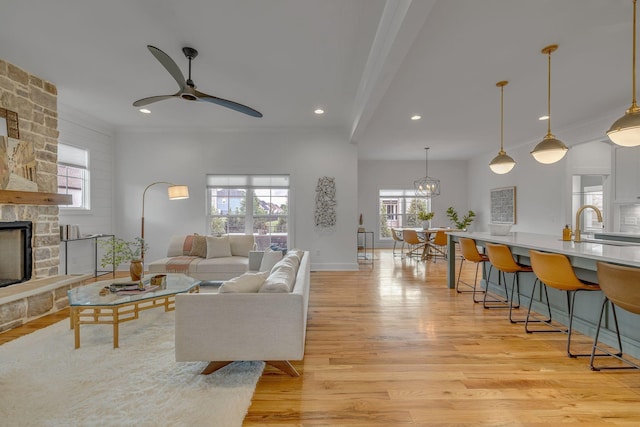 609 Dallas Ct, Murfreesboro, TN 37130 - living room featuring light wood-type flooring, ceiling fan, a fireplace, recessed lighting, and baseboards