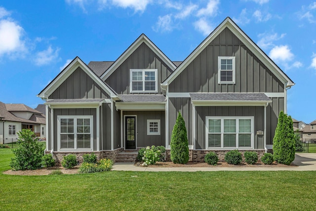 609 Dallas Ct, Murfreesboro, TN 37130 - craftsman-style house featuring board and batten siding, a front yard, roof with shingles, and brick siding