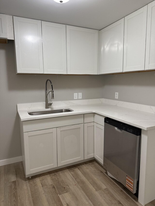 1919 Louanne Dr, Nashville, TN 37217 - kitchen featuring dishwasher, a sink, light wood-type flooring, and white cabinets