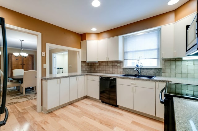 6307 Park Ln, Nashville, TN 37205 - kitchen with black appliances, a sink, white cabinets, light wood-style flooring, and decorative backsplash