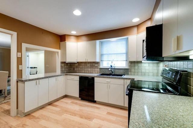 6307 Park Ln, Nashville, TN 37205 - kitchen featuring black appliances, a sink, white cabinetry, decorative backsplash, and light wood-style flooring