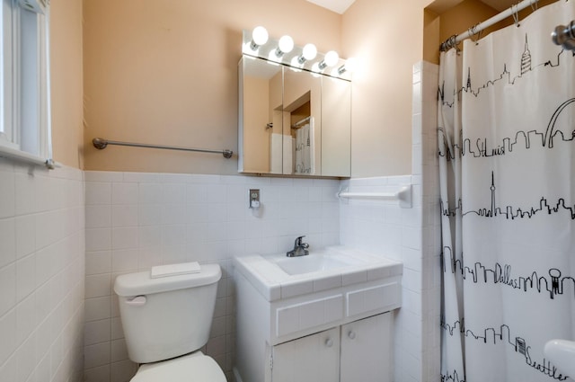 6307 Park Ln, Nashville, TN 37205 - bathroom with tile walls, toilet, vanity, a shower with shower curtain, and a wainscoted wall