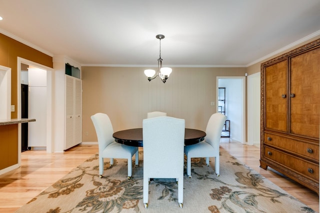 6307 Park Ln, Nashville, TN 37205 - dining room with light wood-type flooring, crown molding, and a chandelier