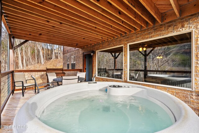 817 Pine Top Ln, Gatlinburg, TN 37738 - view of swimming pool with a wooden deck and a hot tub