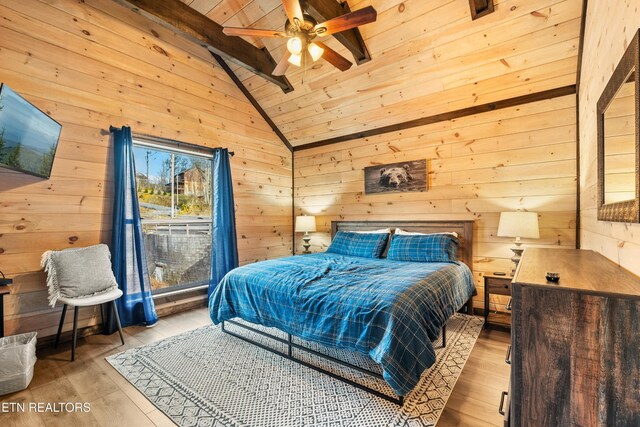 817 Pine Top Ln, Gatlinburg, TN 37738 - bedroom with hardwood / wood-style flooring, wooden walls, wood ceiling, and ceiling fan