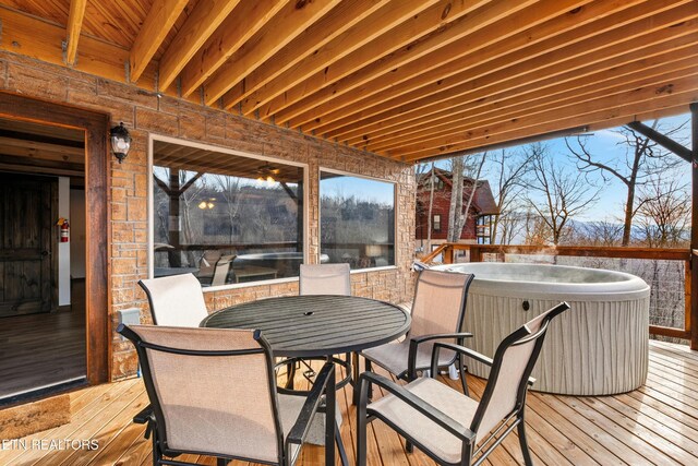 817 Pine Top Ln, Gatlinburg, TN 37738 - wooden terrace featuring a hot tub and outdoor dining area