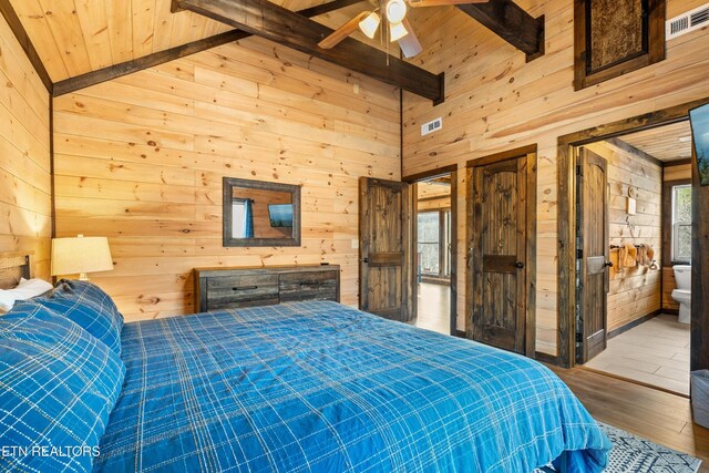 817 Pine Top Ln, Gatlinburg, TN 37738 - bedroom featuring wood walls, wooden ceiling, hardwood / wood-style flooring, and ensuite bath