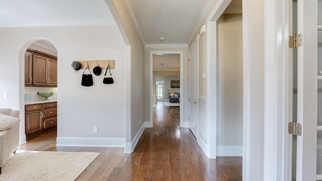 1303 Reynard Dr, Gallatin, TN 37066 - hall featuring dark wood-style floors, arched walkways, ornamental molding, and baseboards