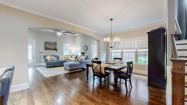 1303 Reynard Dr, Gallatin, TN 37066 - dining room with arched walkways, baseboards, a chandelier, dark wood-style flooring, and stairs